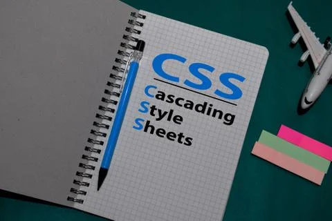 CSS - Cascading Style Sheets acronym write on a book isolated on Office Desk. Stockfoto's