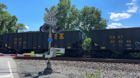 CSX Coke Express train at a railroad crossing Stock Footage 313143058