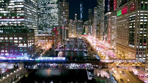 CTA Holiday Train Exits Chicago Loop by Crossing Bridge at Night Stock Footage 121802261