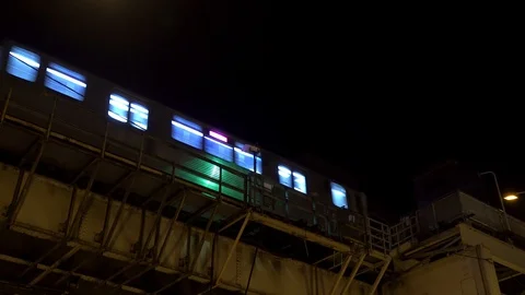 CTA train in Chicago moving on a track at night in 4K Video stock 107577574