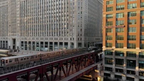 CTA Train Crosses Chicago River During Golden Hour - 4k Stock Footage 104771442