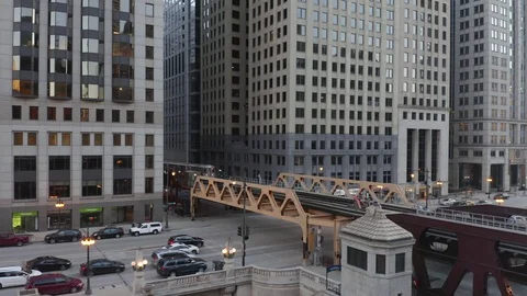 CTA Train Crosses Chicago River During Golden Hour - 4k Video stock 104771496