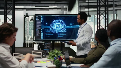 CTO in startup office doing presentation on deep learning tech to investors Stock Footage 323144330
