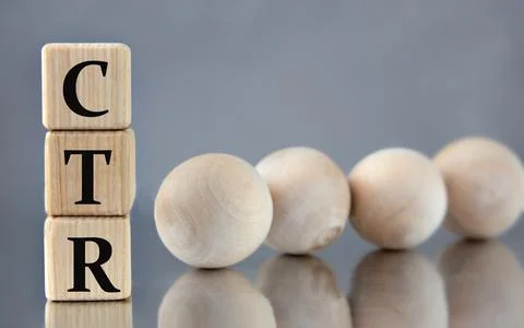 CTR - acronym on wooden cubes on the background of light balls. Stock Photos