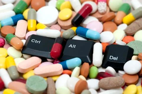 Ctrl, Alt, Del keys among drugs (Enter system, restart system) Stock Photos