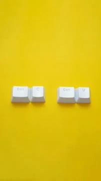 Ctrl C, Ctrl V keyboard buttons, copy and paste key shortcut isolated on a ye Stock Photos
