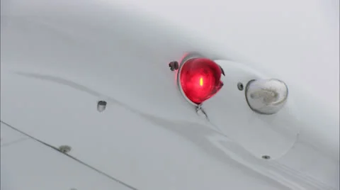 CU Airplane Moving Thru Clouds Wing Light Flashing HD Video Stock Footage 24650007