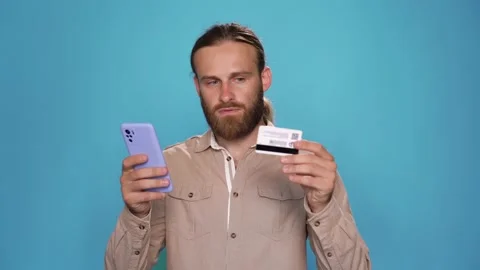 CU of Attractive Guy is entering data from the credit card online shopping Stock Footage 157884516