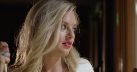 CU beautiful blonde holding pool cue and smiling in slow motion 4K Stock Footage 61925571