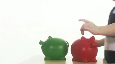 CU Boy (4-5) with two piggy banks Stock Footage 11339624
