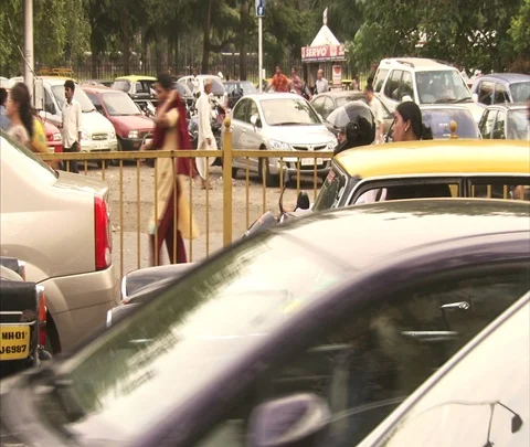 CU bumper to bumper traffic, pedestrians walking on side of road. Stock Footage 86742335