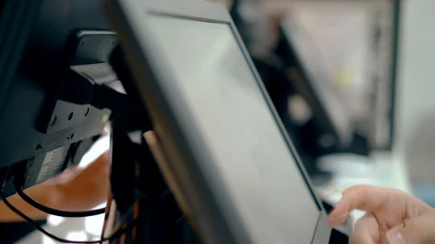 CU: Cashiers are working, touching touch screen, choosing product. Stock Footage 105180439