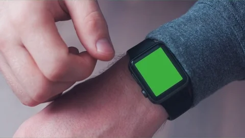 CU Caucasian male using his smart watch. Green screen chroma key. 4K UHD Stock Footage 74683481