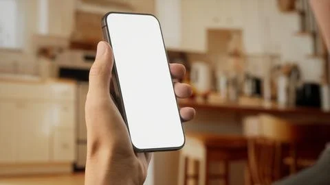 CU Caucasian man using his phone at home Foto stock