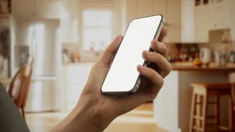 CU Caucasian man using his phone at home 스톡 사진