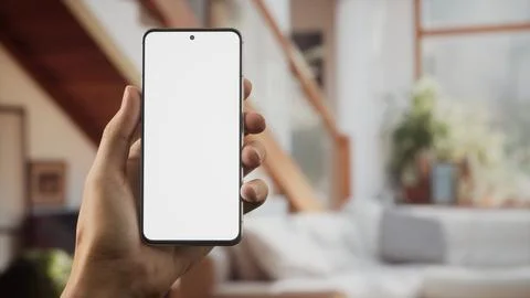 CU Caucasian man using his phone at home Foto stock
