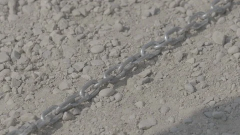 CU of Chain in Dirt and a Hammer Breaking it Apart HD Video Stock Footage 92801381