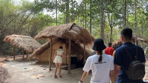Cu Chi, Viet Nam Cu Chi 06.06.2024 excursion group tourists tunnels were the Stock Footage 276910177