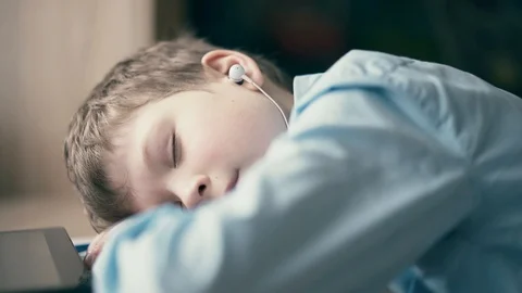 CU: The child fell asleep while he was doing his homework Stock Footage 105099920