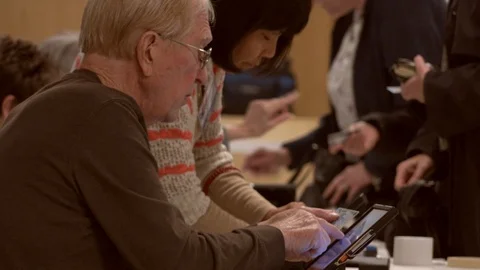 CU clerks I verify Ohio voter Ids at polling place. Stock Footage 106159014
