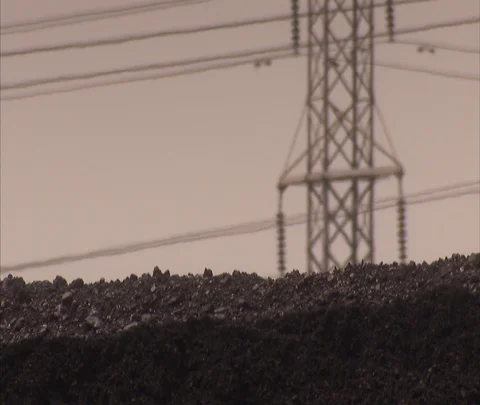 CU coal with power lines in background Stock Footage 86694269