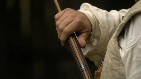 C.U. Colonial Soldier loads black powder flintlock musket Stock Footage 81227445