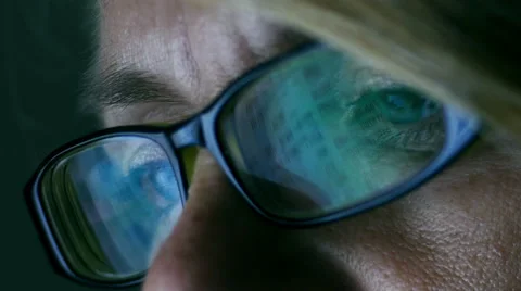 CU of computer reflected in woman's glasses, 4k, UHD Stock Footage 51245859