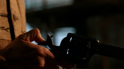CU Cowboy cocks his pistol gun during standoff, CU on hands and holster Stock Footage 194802552