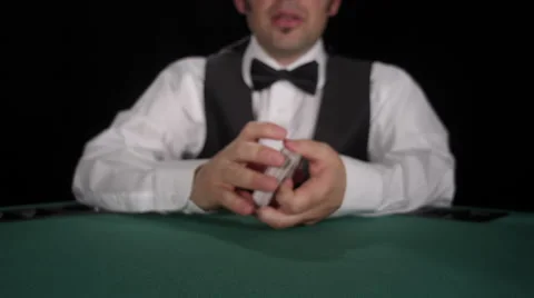 CU of dealer shuffling cards in front of camera Stock Footage 53239281