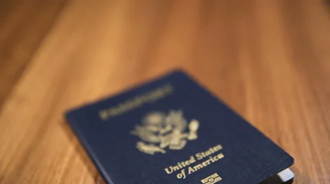 CU Dolly Shot of USA Passport on Wooden Background, Shallow DOF Stock Footage