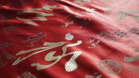 CU DS Red Chinese script on silk fabric Video stock 69952491