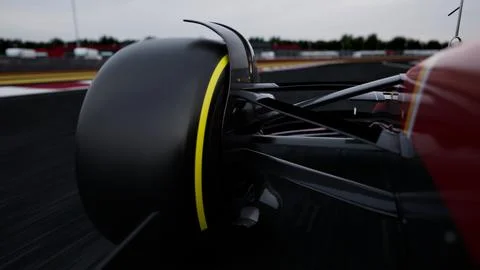 CU dynamic view of a racing car speeding on a race track Stock Photos