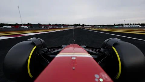 CU dynamic view of a racing car speeding on a race track Stock Photos