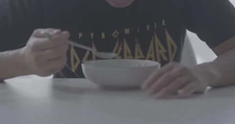 CU Eating Breakfast  Cool Asian Man HUngover.mp4 Stock Footage 196849471
