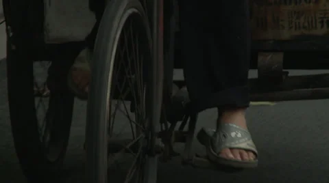 CU feet pedalling + front wheel Stock Footage 37697071