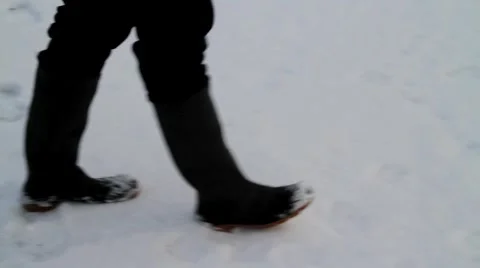 Cu feet walking in snow Stock Footage 1049018