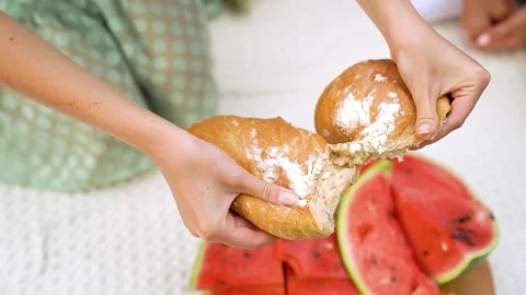 CU female hands breaking bread. Break off piece of bread Stock Footage 158886372