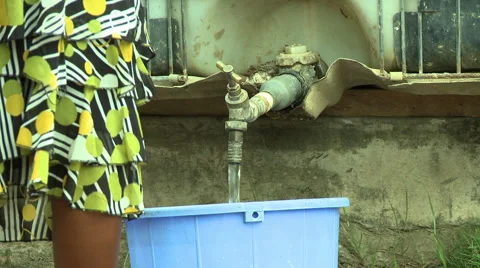 CU FILLING WATER BUCKET FROM POLYTANK Stock Footage 57981745