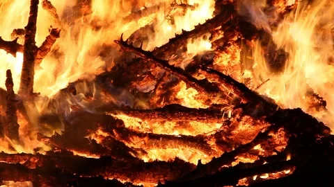 CU of fire then panning up to ember in air Stock Footage 122306674