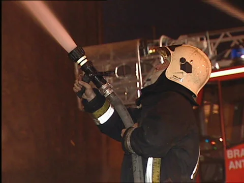 CU firefighter with waterhose Stock Footage 655449