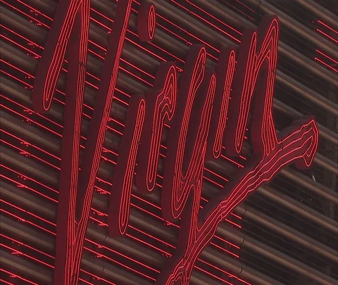CU flashing neon sign for Virgin Music store Stock Footage 86699650