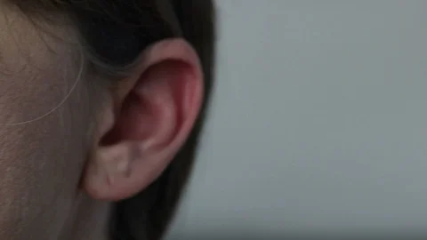 CU of front Angle of Woman's Ear then she Turns Head to ECU Side of Head and Ear Видео 87031969
