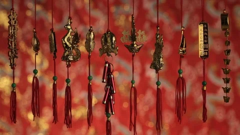 CU Gold Chinese decorations hanging from red strings Stock Footage 69953317