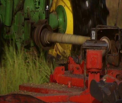 CU grass cutting blades being pulled by tractor Stock Footage 86746962