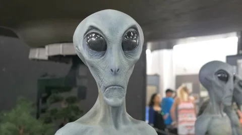 CU grey gray alien face model display in museum  Stock Footage 54015624