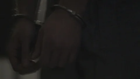 CU Handcuffed Man Being Led Out of Jail HD Video Stock Footage 91866957