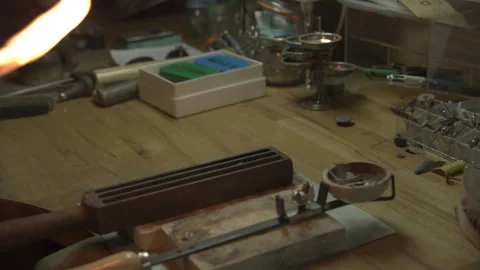 CU Heating metal to melt it in a crucible Stock Footage 253310045