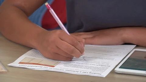 CU Hispanic girl writing Stock Footage 99375212