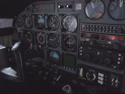 C/u instrument panel inside Cessna, pilot turns knobs 스톡 동영상 86753052