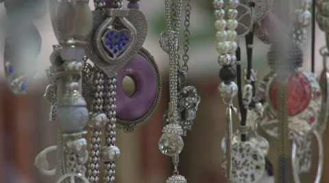 CU Jewelry hanging in Market Stock Footage